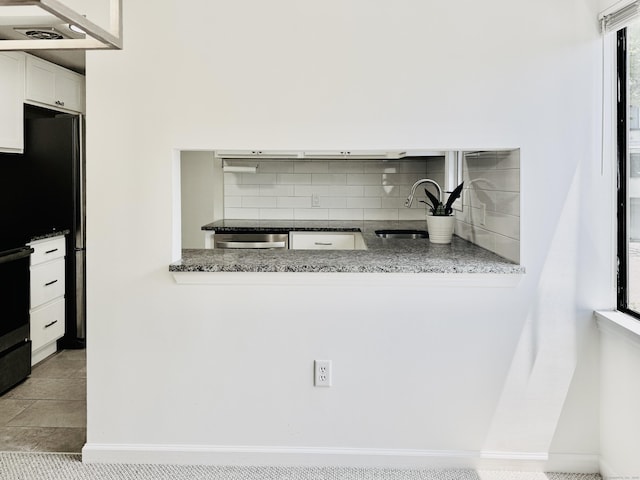 93 Trolley Crossing Ln Unit 93, Middletown, CT 06457 - kitchen featuring tasteful backsplash, white cabinets, stone countertops, and stainless steel dishwasher