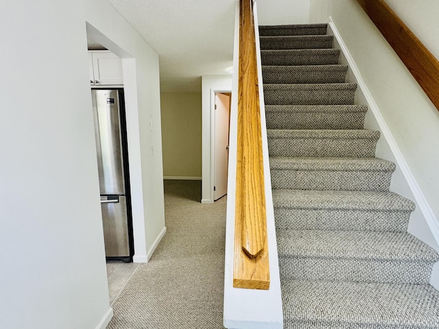 93 Trolley Crossing Ln Unit 93, Middletown, CT 06457 - staircase with baseboards and carpet