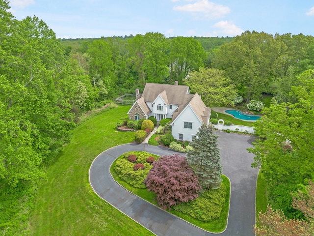 7 Merlins Ln, Newtown, CT 06470 - aerial view of property and surrounding area with a pool area and a heavily wooded area
