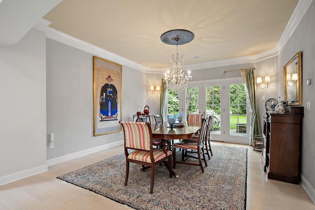 7 Merlins Ln, Newtown, CT 06470 - dining room featuring a chandelier, ornamental molding, and light wood-style flooring