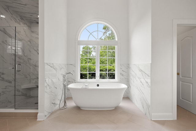 7 Merlins Ln, Newtown, CT 06470 - full bathroom featuring tile walls, a marble finish shower, a soaking tub, and a wainscoted wall