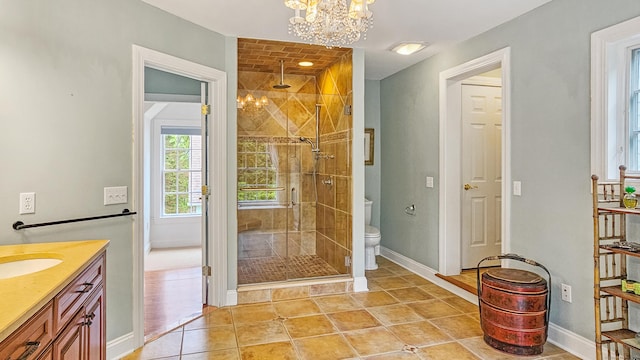 7 Merlins Ln, Newtown, CT 06470 - bathroom featuring a chandelier, a shower stall, vanity, and tile patterned flooring
