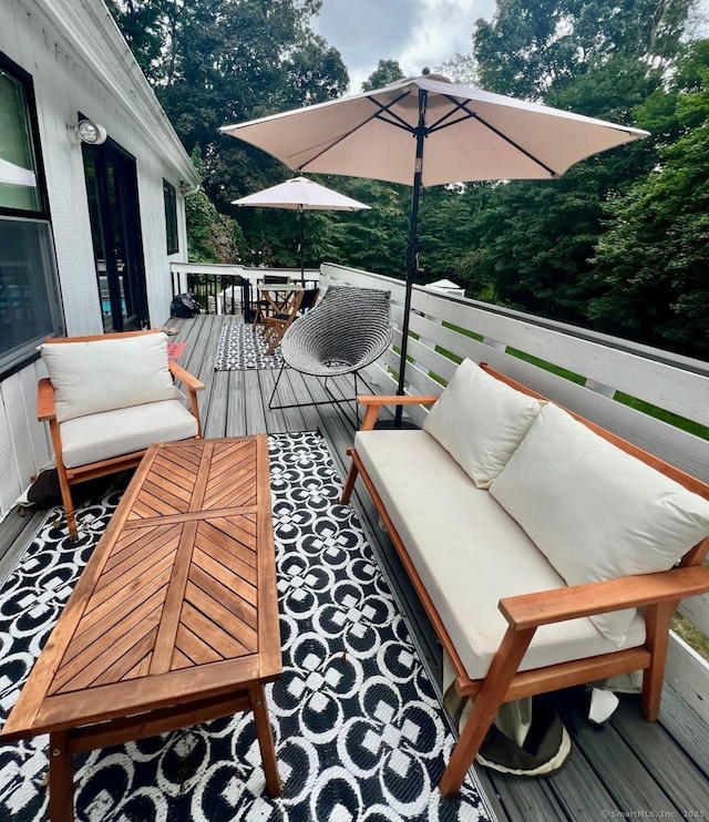 25 Hidden Pl, Cheshire, CT 06410 - wooden terrace featuring an outdoor hangout area, outdoor dining space, and view of scattered trees