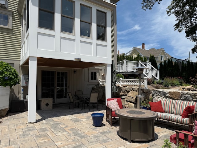 5 Lees Ct, Stonington, CT 06378 - view of patio / terrace with an outdoor living space with a fire pit, stairs, and outdoor dining space