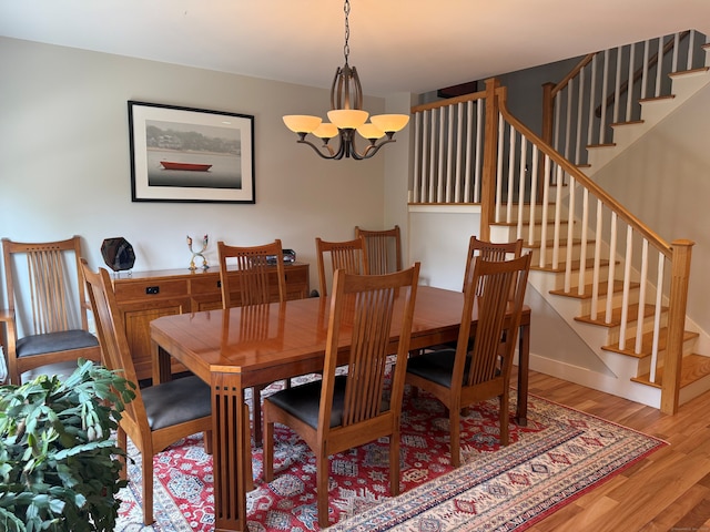 5 Lees Ct, Stonington, CT 06378 - dining space with wood finished floors, a chandelier, and stairway