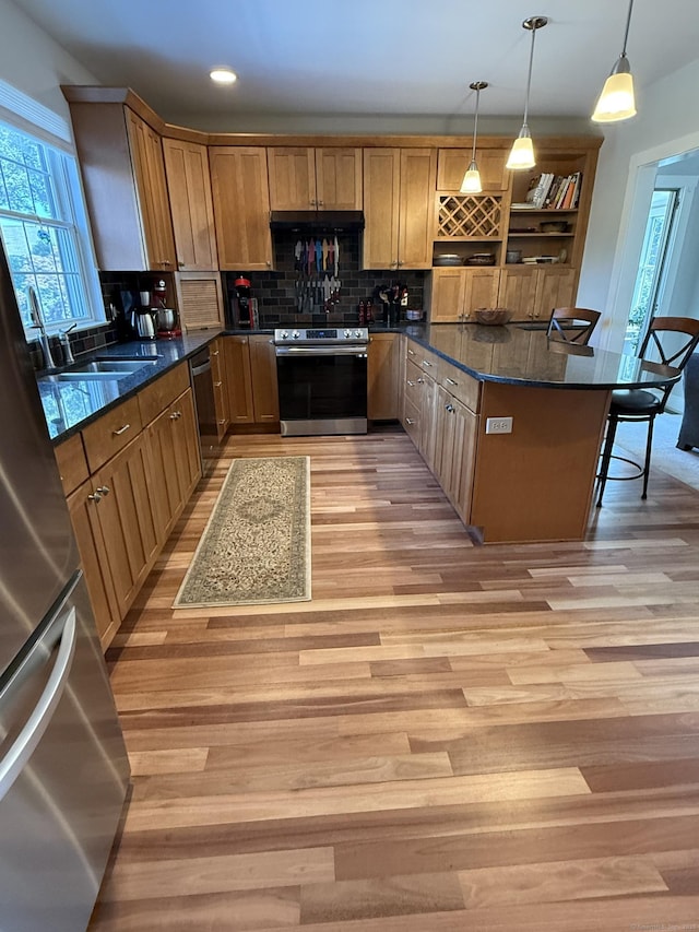 5 Lees Ct, Stonington, CT 06378 - kitchen featuring appliances with stainless steel finishes, light wood finished floors, decorative backsplash, and recessed lighting
