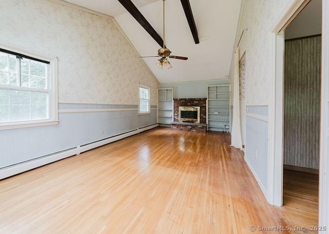 2 Rolf Dr, Danbury, CT 06810 - unfurnished living room with wallpapered walls, wood finished floors, wainscoting, a brick fireplace, and a ceiling fan