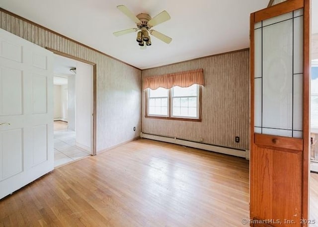 2 Rolf Dr, Danbury, CT 06810 - unfurnished room with a baseboard radiator, a ceiling fan, wood finished floors, and ornamental molding