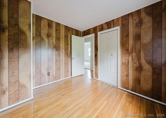 2 Rolf Dr, Danbury, CT 06810 - unfurnished bedroom with wood finished floors and wood walls