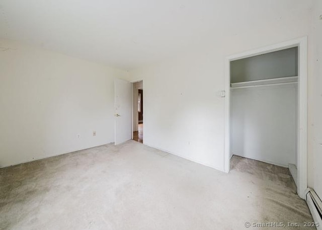 2 Rolf Dr, Danbury, CT 06810 - unfurnished bedroom featuring light carpet, baseboard heating, and a closet