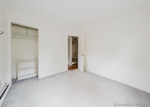 2 Rolf Dr, Danbury, CT 06810 - unfurnished bedroom featuring carpet floors, a closet, and a baseboard heating unit