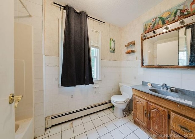 2 Rolf Dr, Danbury, CT 06810 - full bathroom with baseboard heating, tile walls, tile patterned floors, vanity, and shower / tub combination