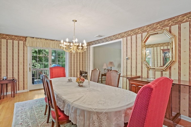 6 Robert Frost Dr, Shelton, CT 06484 - dining room featuring wallpapered walls, a chandelier, and light wood-type flooring