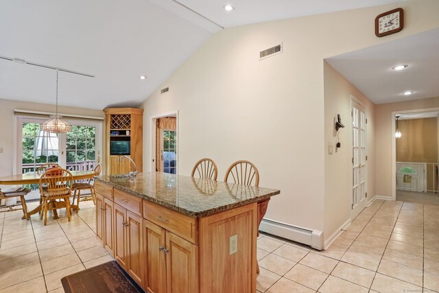 6 Robert Frost Dr, Shelton, CT 06484 - kitchen featuring a baseboard radiator, vaulted ceiling, light tile patterned flooring, dark stone counters, and a center island