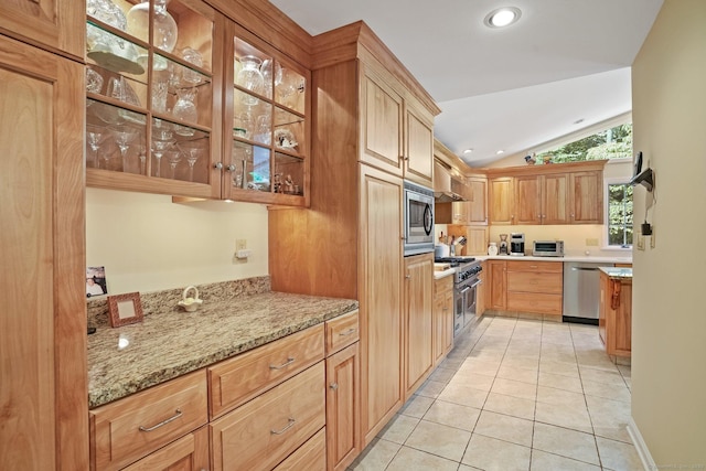 6 Robert Frost Dr, Shelton, CT 06484 - kitchen featuring stainless steel appliances, exhaust hood, light tile patterned floors, vaulted ceiling, and light stone counters