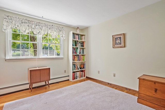 6 Robert Frost Dr, Shelton, CT 06484 - living area featuring wood finished floors and a baseboard heating unit