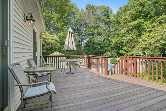6 Robert Frost Dr, Shelton, CT 06484 - wooden deck with outdoor dining space and view of wooded area