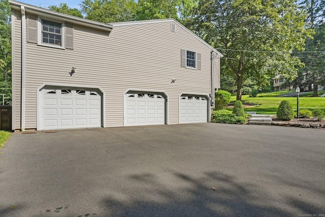 6 Robert Frost Dr, Shelton, CT 06484 - view of home's exterior with asphalt driveway and an attached garage