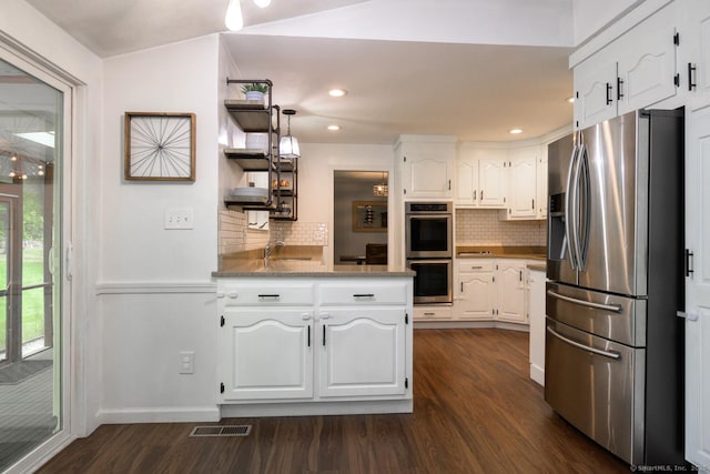 66 Del Prado Dr, Bristol, CT 06010 - kitchen featuring stainless steel appliances, dark wood-style floors, white cabinets, open shelves, and decorative backsplash