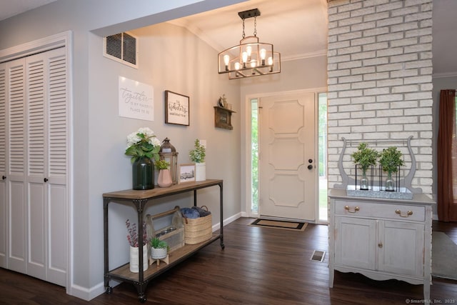 66 Del Prado Dr, Bristol, CT 06010 - entryway featuring ornamental molding, dark wood finished floors, and a chandelier