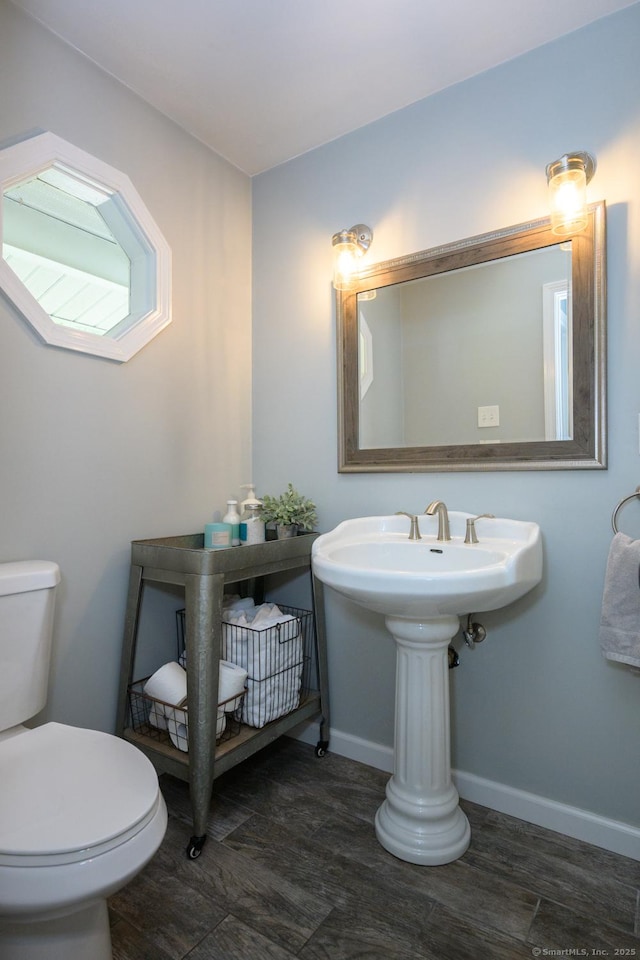 66 Del Prado Dr, Bristol, CT 06010 - half bathroom with toilet and wood finished floors