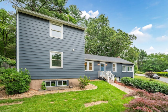 16 Pine Rd, Stafford, CT 06076 - view of front facade featuring a front yard and a chimney