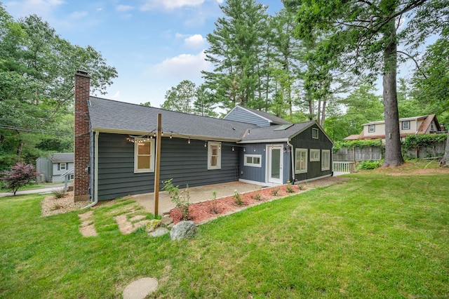 16 Pine Rd, Stafford, CT 06076 - back of property with a patio, a chimney, and a shingled roof