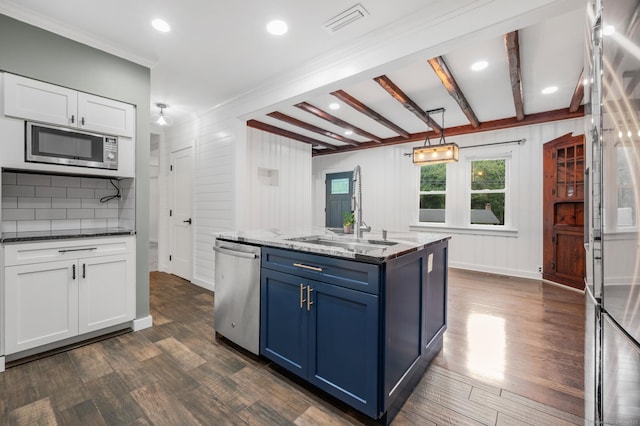16 Pine Rd, Stafford, CT 06076 - kitchen with appliances with stainless steel finishes, dark wood-style flooring, blue cabinetry, white cabinetry, and decorative backsplash