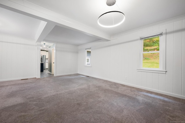 16 Pine Rd, Stafford, CT 06076 - carpeted empty room featuring beam ceiling