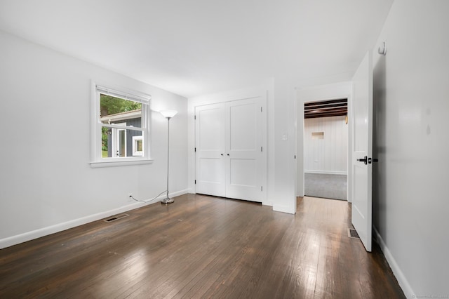 16 Pine Rd, Stafford, CT 06076 - unfurnished bedroom with dark wood-type flooring and a closet