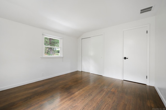 16 Pine Rd, Stafford, CT 06076 - unfurnished bedroom featuring dark wood finished floors, vaulted ceiling, and a closet