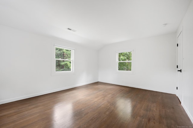 16 Pine Rd, Stafford, CT 06076 - empty room with healthy amount of natural light, wood finished floors, lofted ceiling, and a smoke detector
