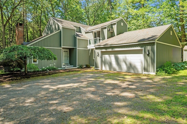 25 Tall Wood Holw, Avon, CT 06001 - mid-century modern home featuring a garage, a shingled roof, driveway, and a chimney