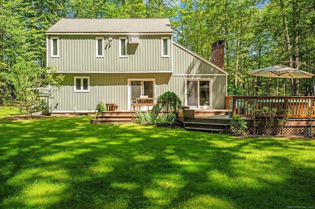 25 Tall Wood Holw, Avon, CT 06001 - back of house with a chimney, a wooden deck, a yard, and roof with shingles