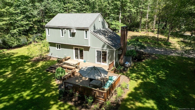 25 Tall Wood Holw, Avon, CT 06001 - rear view of house featuring a deck, a lawn, a shingled roof, a chimney, and a view of trees