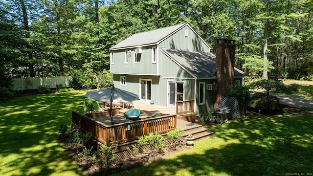 25 Tall Wood Holw, Avon, CT 06001 - rear view of house featuring a chimney, a wooden deck, and roof with shingles