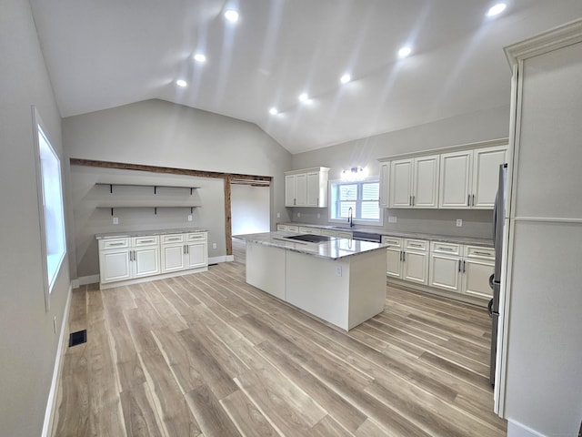 203 Old Jewett City Rd, Preston, CT 06365 - kitchen with light wood finished floors, lofted ceiling, white cabinetry, a kitchen island, and recessed lighting