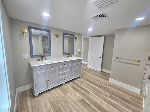 203 Old Jewett City Rd, Preston, CT 06365 - bathroom featuring double vanity, wood finished floors, and recessed lighting