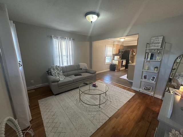 7 Suffolk Dr, East Hartford, CT 06118 - living room featuring dark wood-type flooring and baseboards