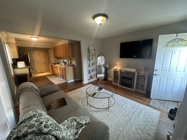 7 Suffolk Dr, East Hartford, CT 06118 - living room featuring dark wood-style flooring and a fireplace