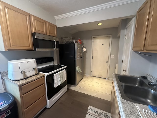 7 Suffolk Dr, East Hartford, CT 06118 - kitchen with stainless steel microwave, white electric range oven, freestanding refrigerator, ornamental molding, and light countertops