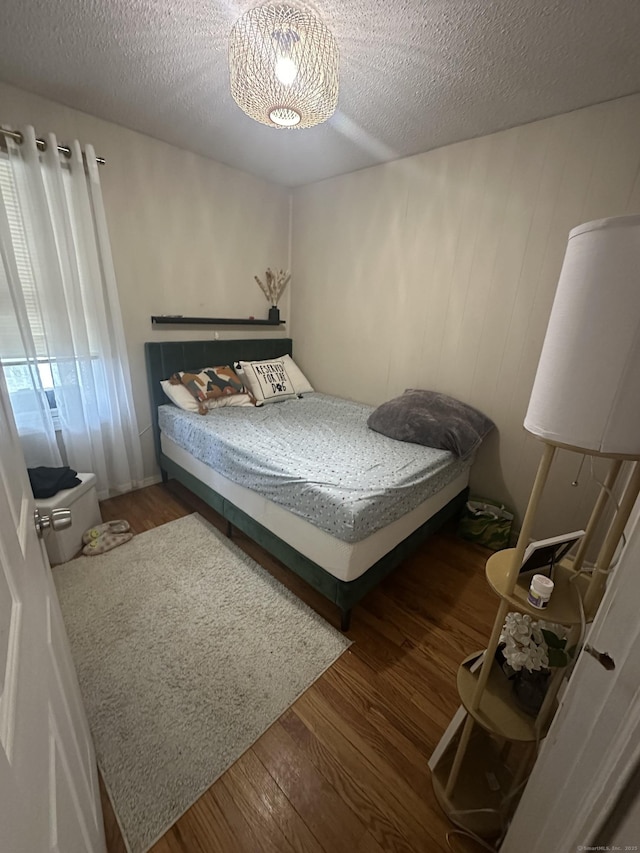 7 Suffolk Dr, East Hartford, CT 06118 - bedroom featuring wood finished floors and a textured ceiling
