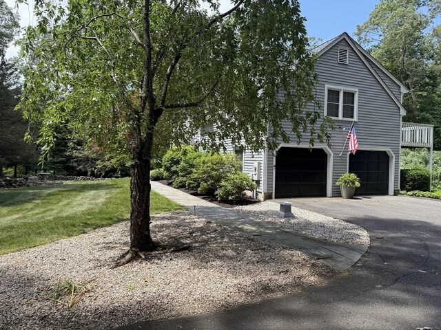 160 Cobbler Ln, Southbury, CT 06488 - view of front of house featuring a garage, asphalt driveway, and a front lawn