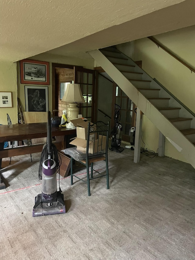 100 Park Rd, Oxford, CT 06478 - below grade area featuring a textured ceiling, stairway, and carpet