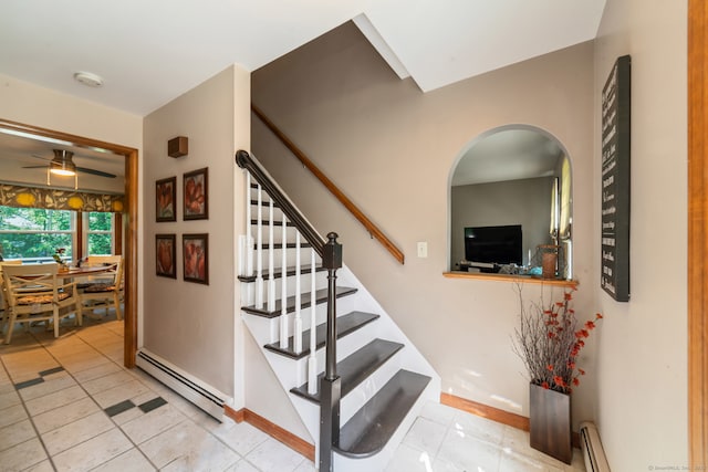 48 Greenwood Cir, Seymour, CT 06483 - stairs featuring baseboard heating, tile patterned flooring, arched walkways, and a ceiling fan