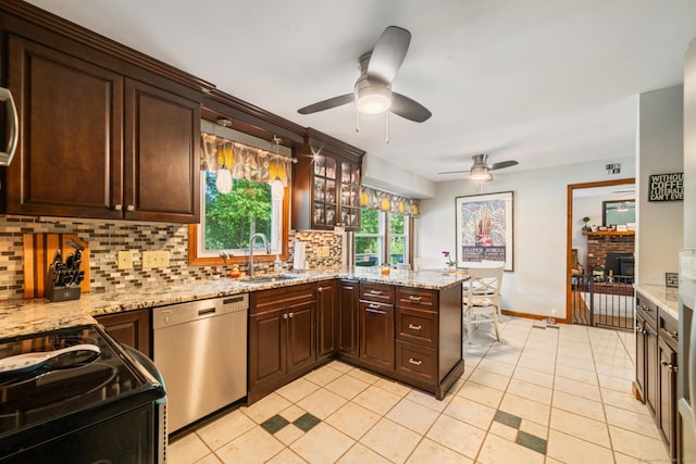 48 Greenwood Cir, Seymour, CT 06483 - kitchen with stainless steel dishwasher, ceiling fan, backsplash, black / electric stove, and dark brown cabinets