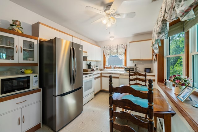 48 Greenwood Cir, Seymour, CT 06483 - kitchen featuring white appliances, healthy amount of natural light, light countertops, and ceiling fan
