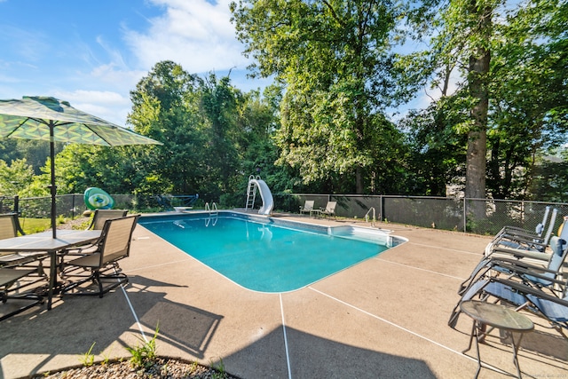 48 Greenwood Cir, Seymour, CT 06483 - view of swimming pool with a water slide, a patio, and view of wooded area