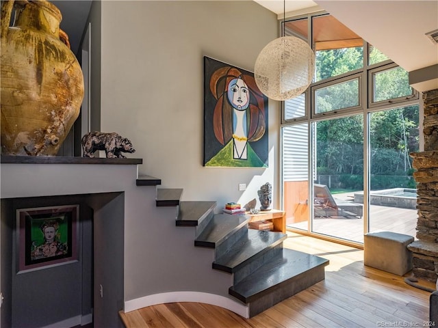 10 Firetower Rd, Killingworth, CT 06419 - living area featuring wood finished floors, stairs, and a towering ceiling