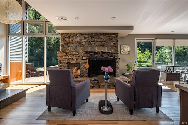 10 Firetower Rd, Killingworth, CT 06419 - living room with hardwood / wood-style floors and a stone fireplace